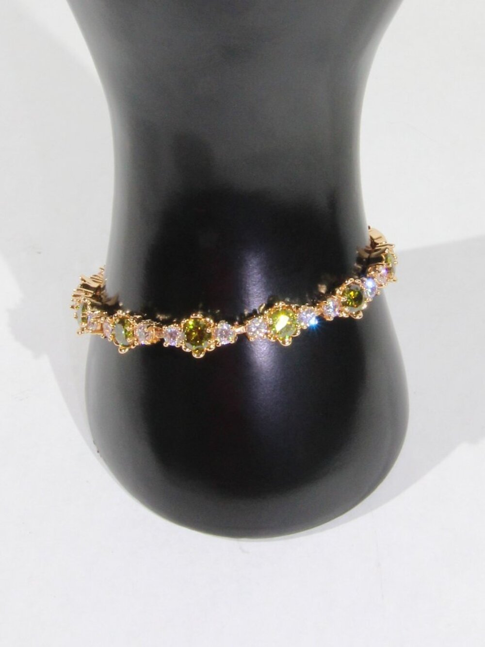 Gold-Tone Tennis Bracelet with Green and Clear Crystals